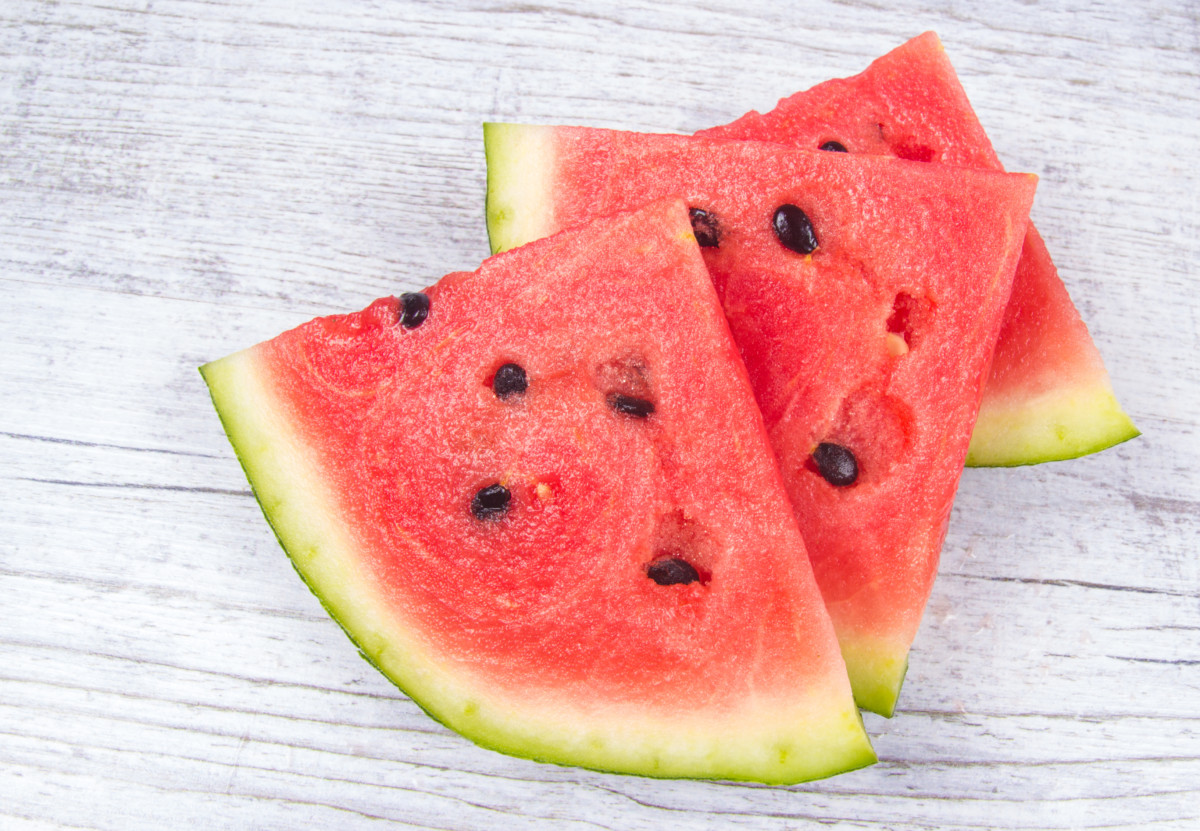 Watermelon slices on a white board background
